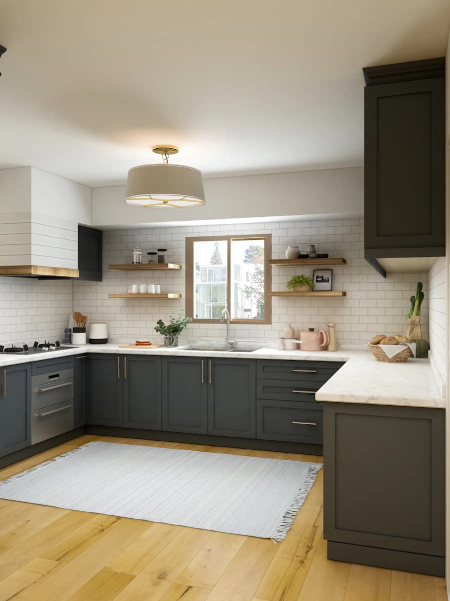 Designer kitchen with deep green cabinetry, marble counters, and open shelving.